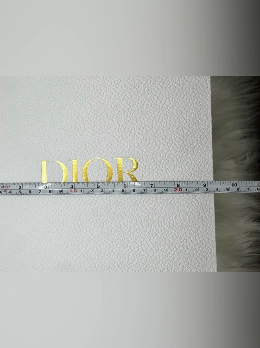 Dior White Gift Box with Gold Logo and protective wrapping inside